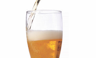 Beer being pour on a glass