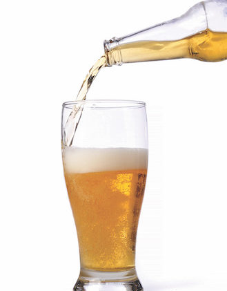 Beer being pour on a glass