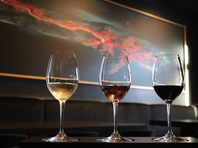 Glasses of white, rose and red wine on the bar
